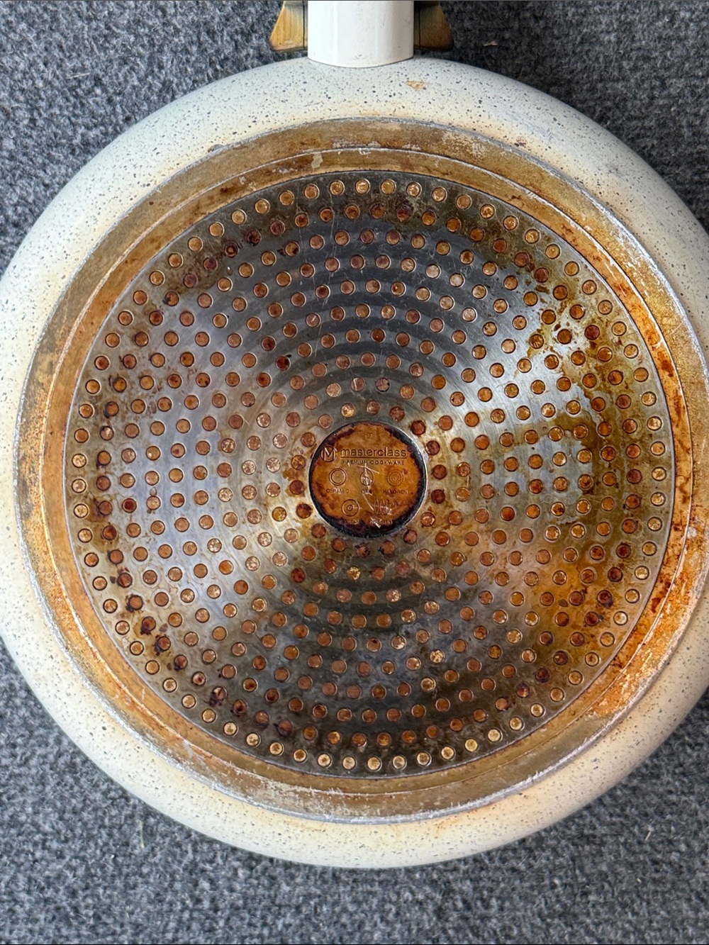 Speckled White Round Wall Art with Warm Rust Accents